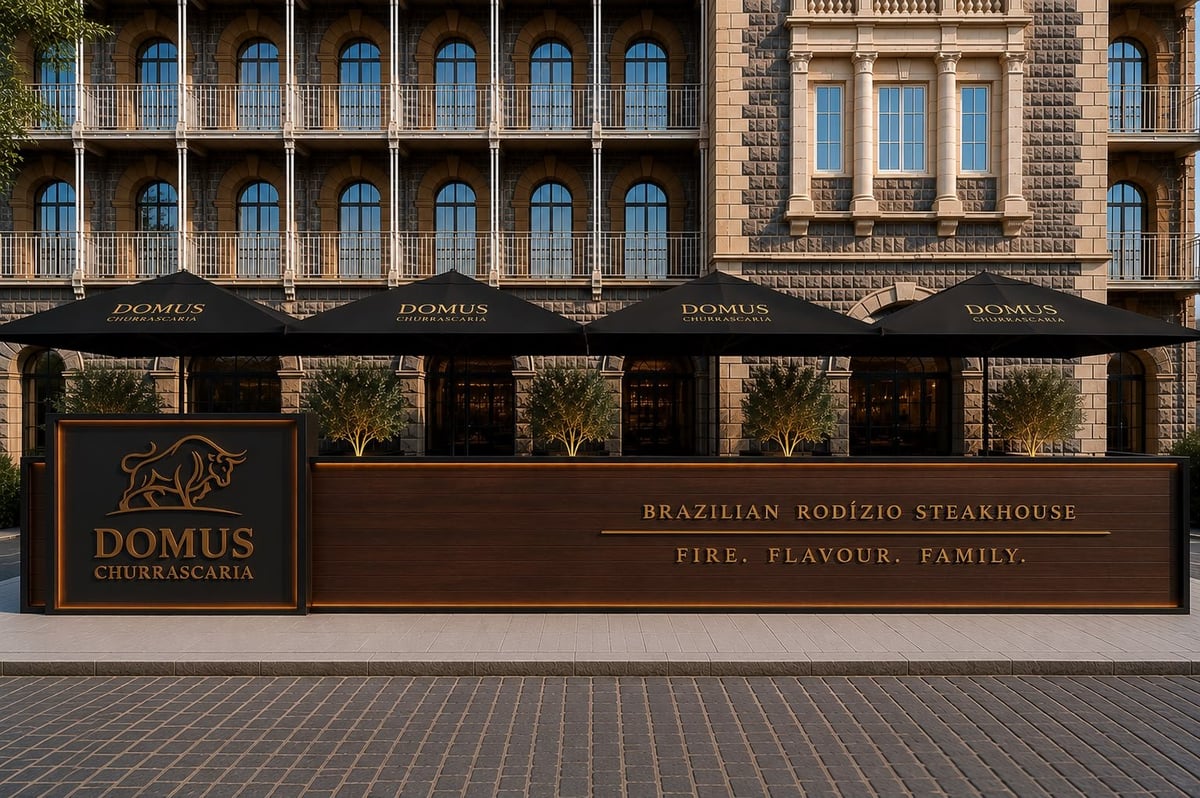 Domus Brazilian Steakhouse storefront with brown signage and arched windows on a brick building facade